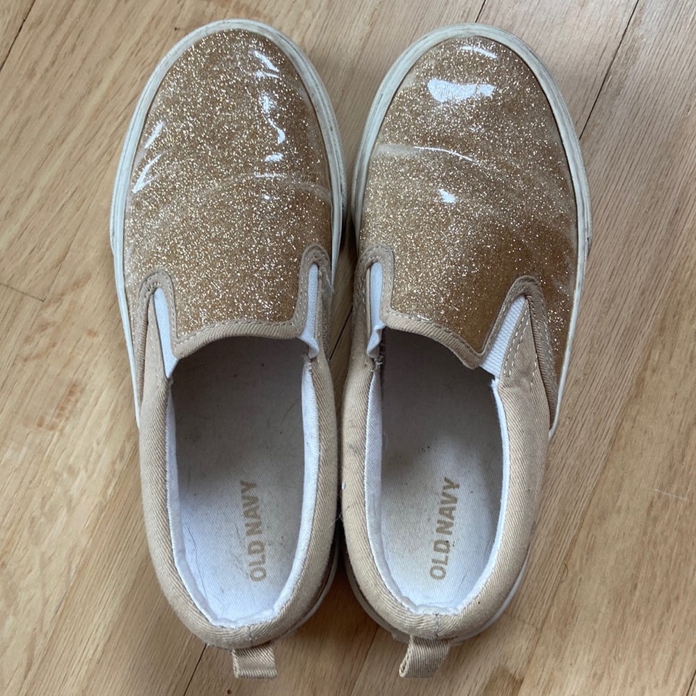 Gold glitter slip on girl’s shoes. Size 2